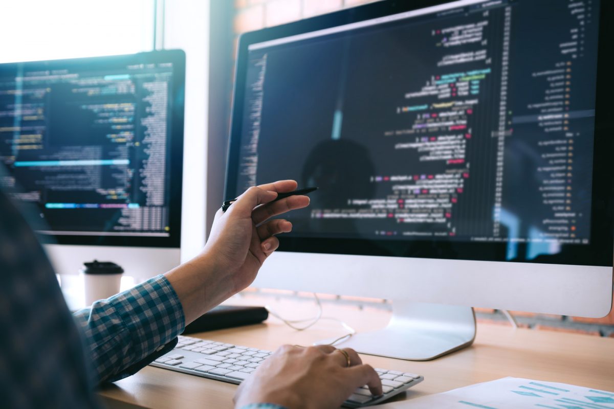 A team of web developers collaborating in a modern office.
